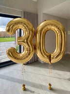 Gold helium number balloons spelling 30