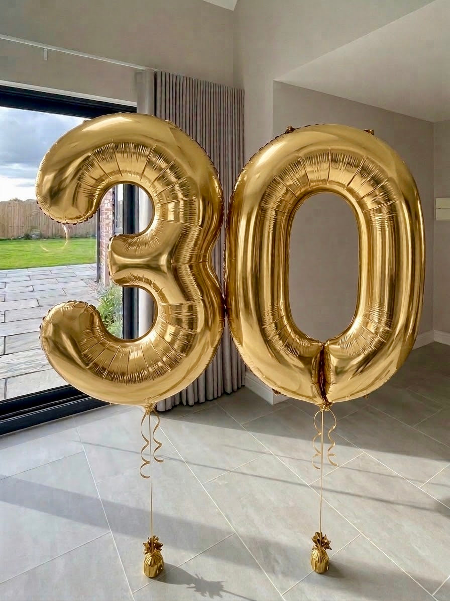 Gold helium number balloons spelling 30