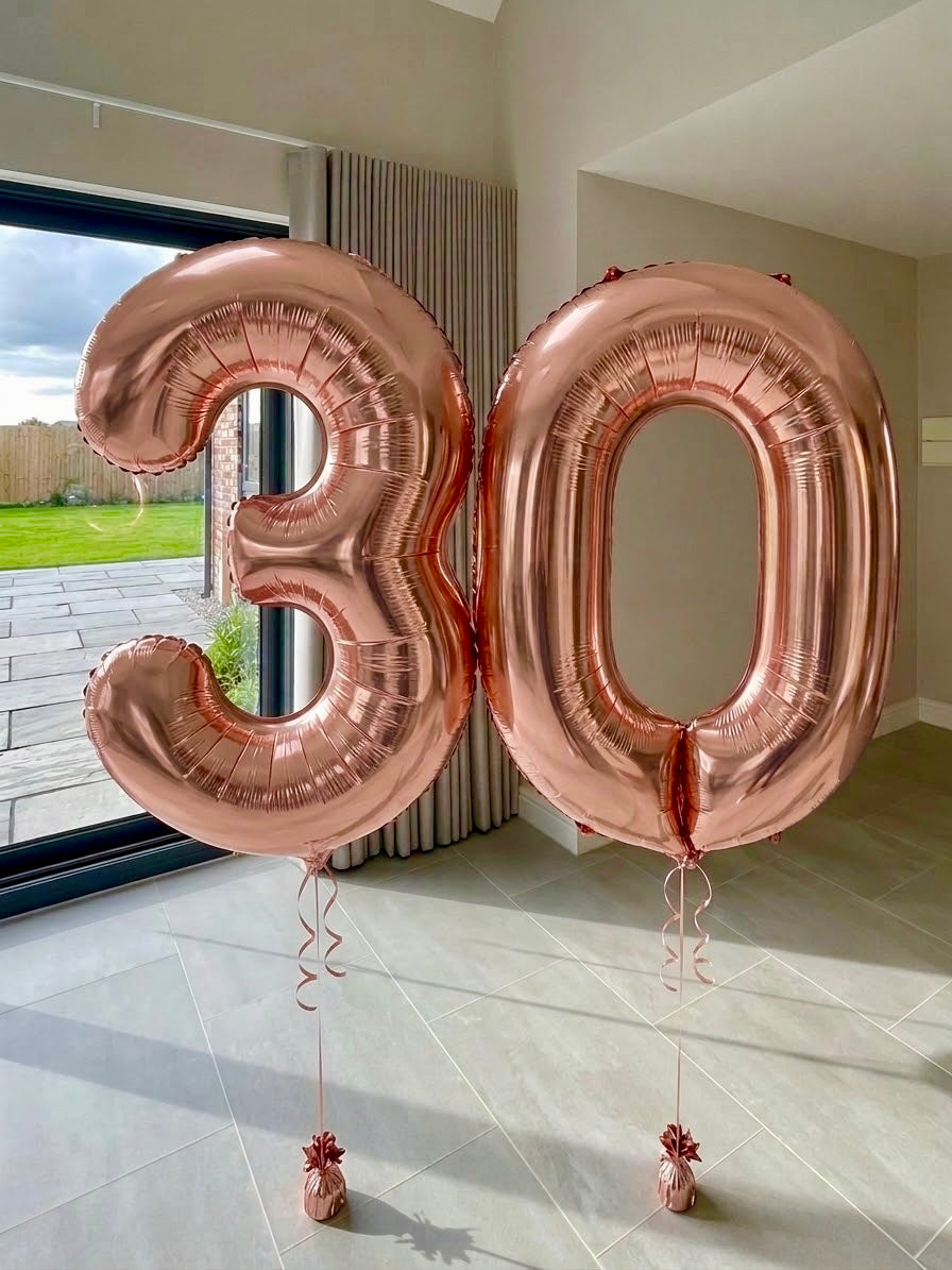 Rose gold helium number balloons spelling 30